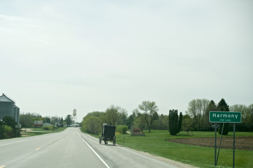 Photo of an Amish buggy and a town sign in Harmony, Minnesota