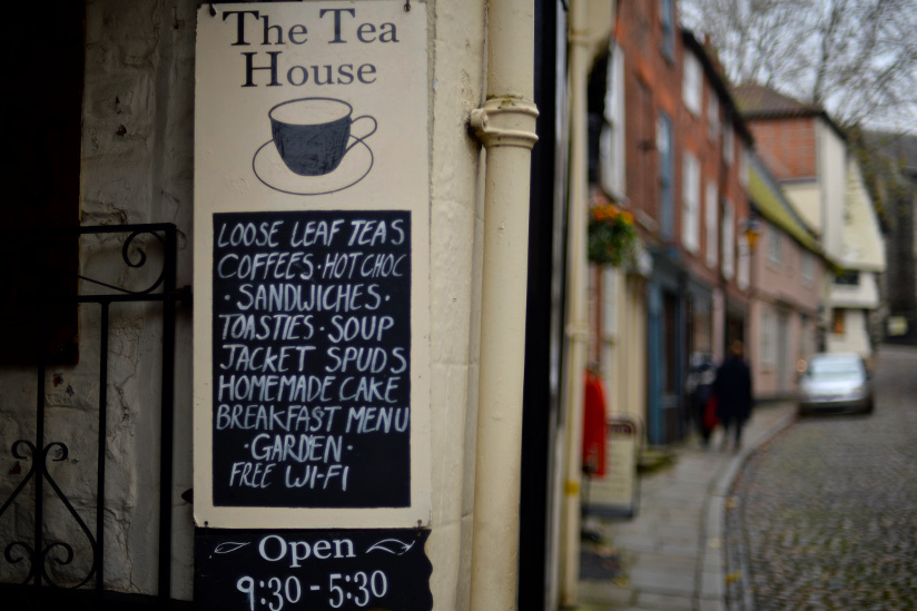 Close-up photo of The Tea House sign in Norwich, England