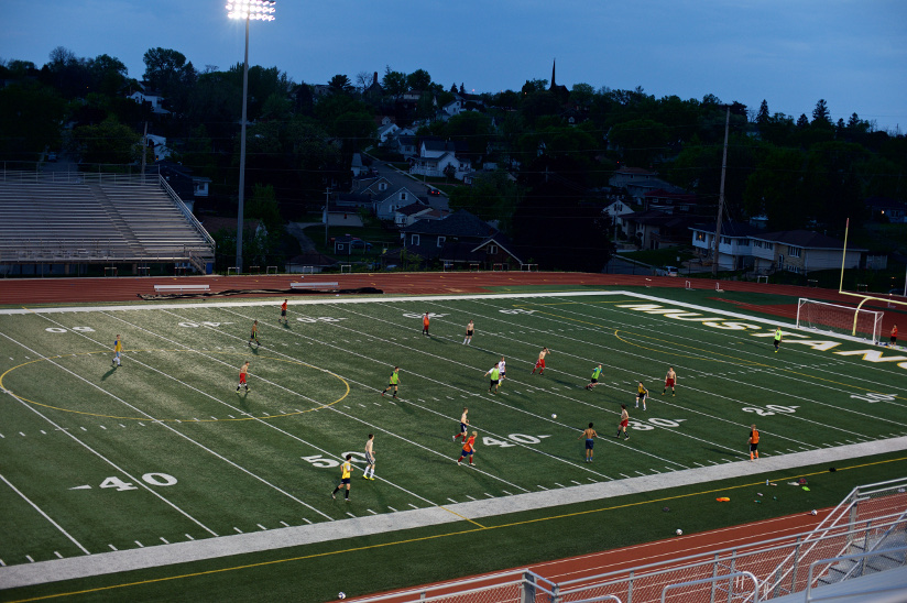 Photo of a soccer match played on an American football pitch