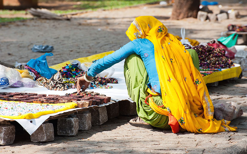 Photo of a girl selling bangles on the street