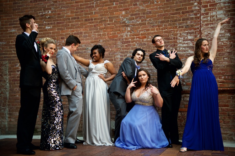 Photo of a group of friends who are dressed up and ready for the prom