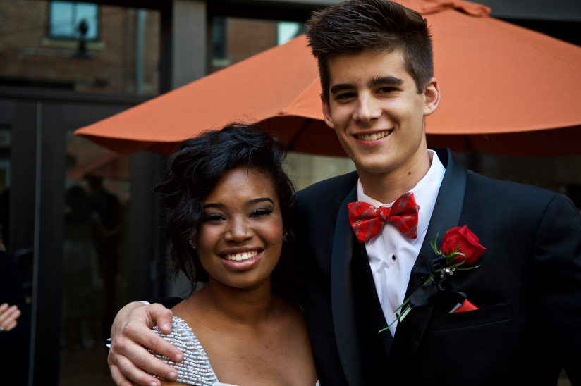 Photo of a teenage boy and girl dressed up and ready for the prom