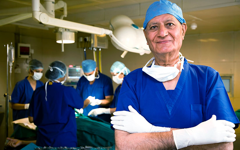 Photo of a male doctor and his staff at a hospital