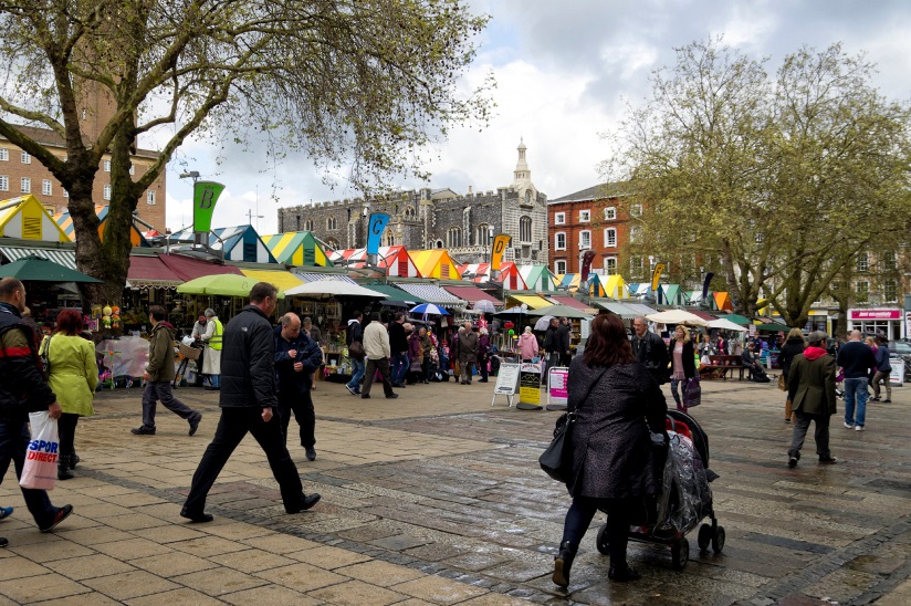 Photo of the Norwich Market with stalls and customers